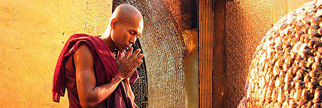 Burmese monk is praying