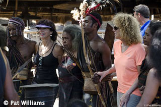 Cindi and guests dancing with Abui Mountain people