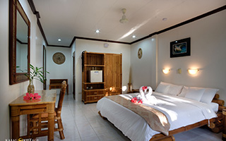 Double bed - Pool view deluxe room - Kasai Village Dive Resort, Moalboal - Philippines Dive Resort